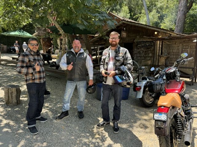 Three riders at a rustic roadside tavern near Santa Barbara